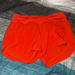 Women's lululemon. Speed up mid rise. 4in inseam. Solar Orange